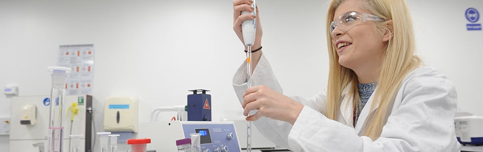 Science student using a range of equipment